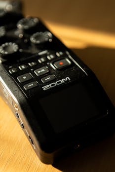 Detailed view of a digital audio recorder with control buttons and logo.