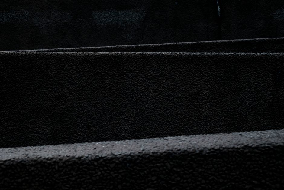 A dark and minimalist black texture pattern ideal for backgrounds and design use.