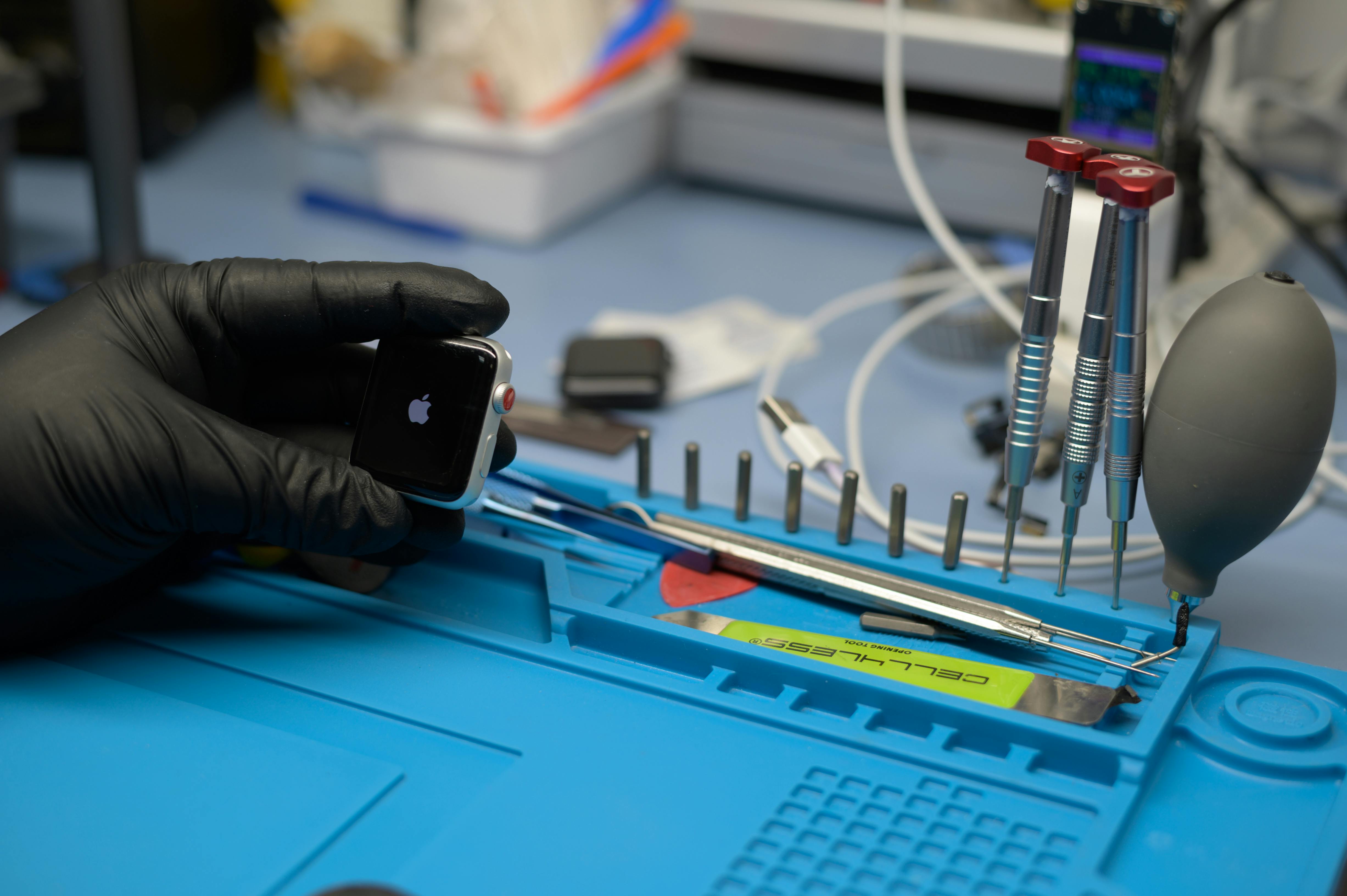 Person Wearing White Apple Watch While Holding Green Dumbbell · Free