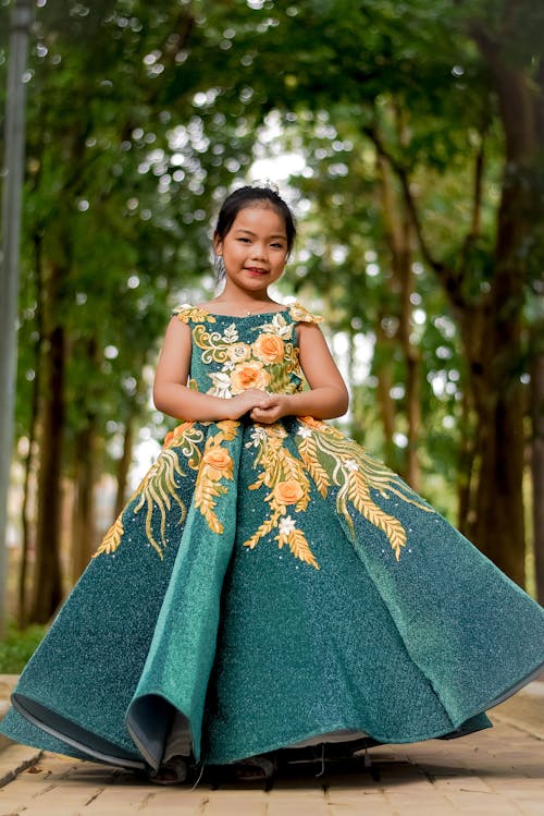Photo of a Girl Wearing a Gown