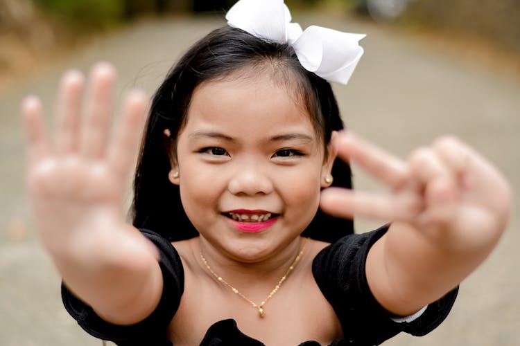 Little Girl Showing Number On Fingers