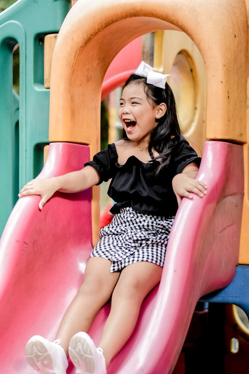 Free Happy Girl on a Slide Stock Photo