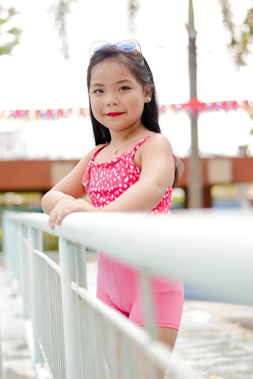 Girl Holding on a Railing