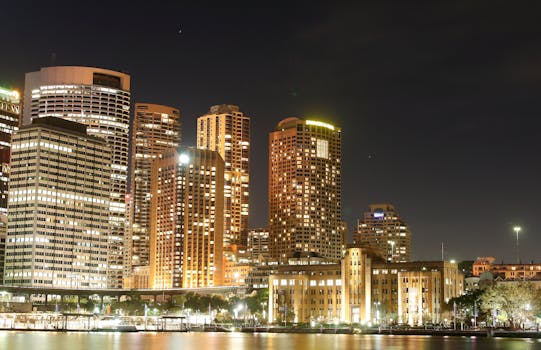 A stunning city skyline with skyscrapers illuminated against the night sky.