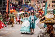 Colorful traditional parade with dancers and costumes in Huánuco, Perú, celebrating cultural heritage.
