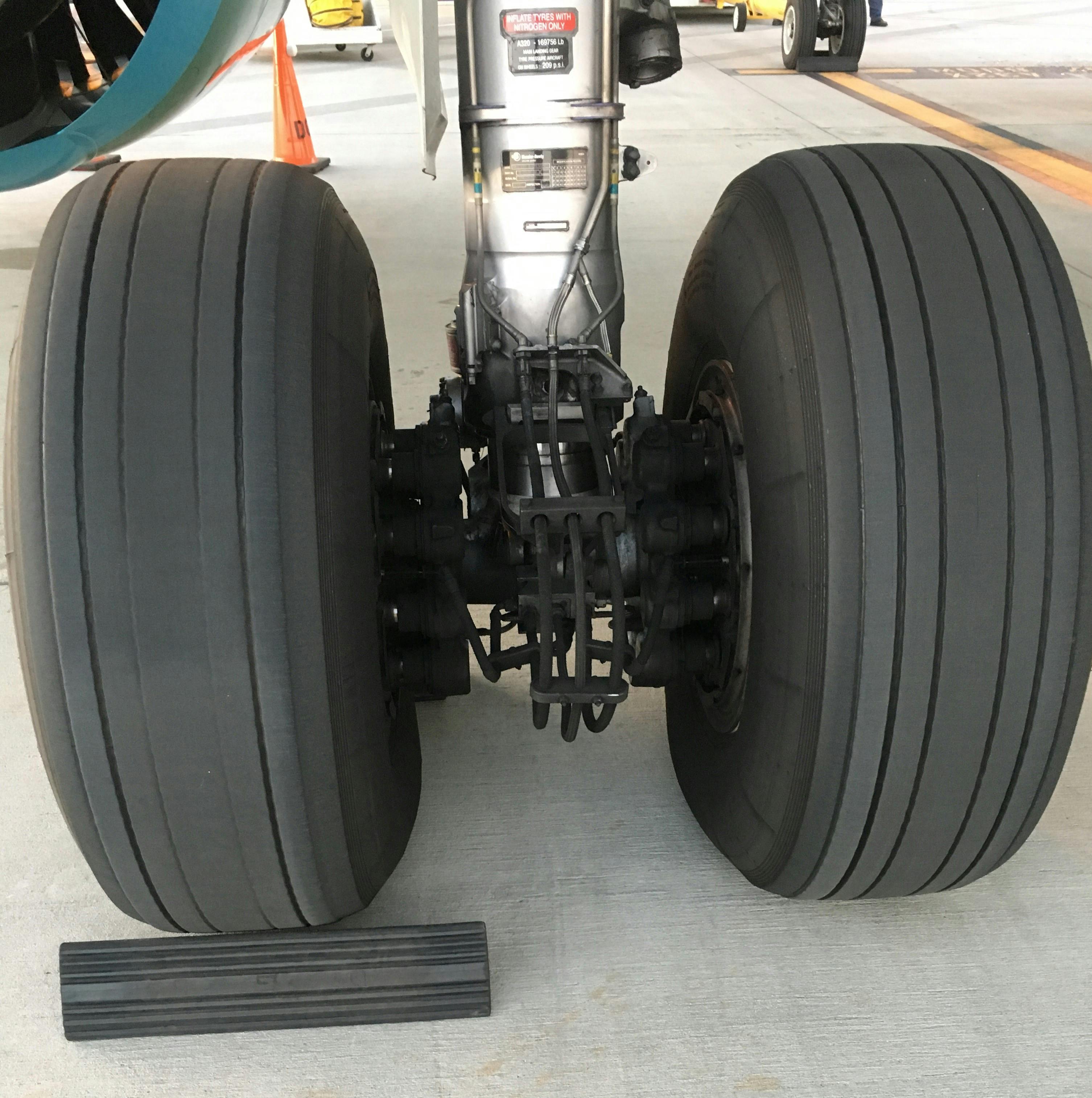 Free stock photo of airplane, airplane tires, airplanes