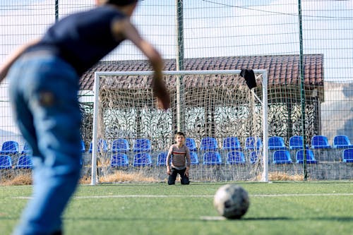 Boys Playing Soccer on a Soccer Field