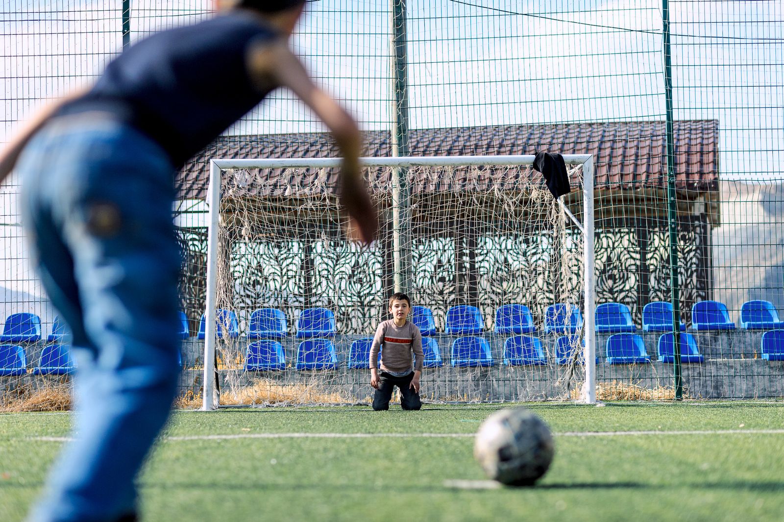 Students playing football on a school ground