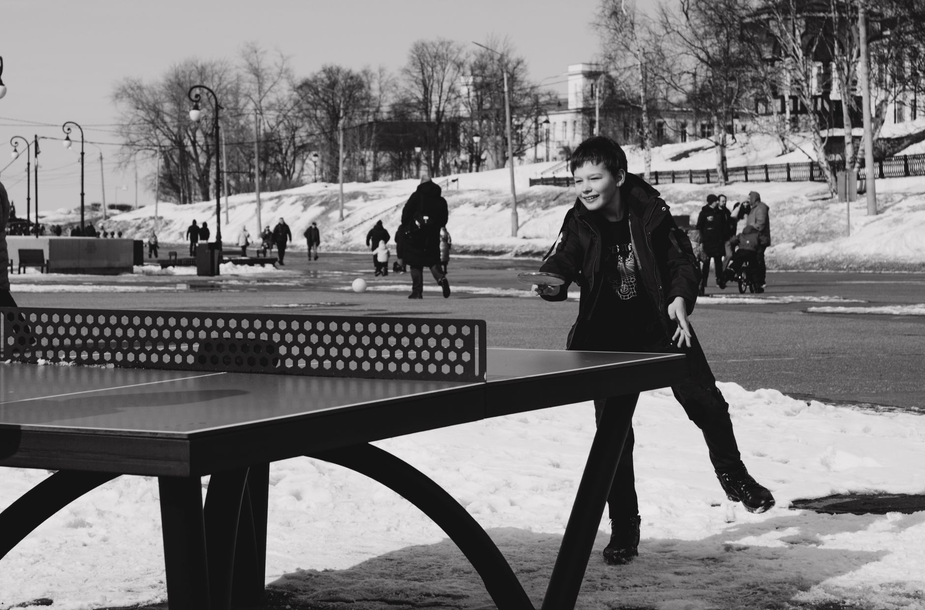 Table Tennis vs. Ping Pong: Key Differences in the US A child enjoys a game of table tennis on a snowy day in Arkhangelsk, Russia.