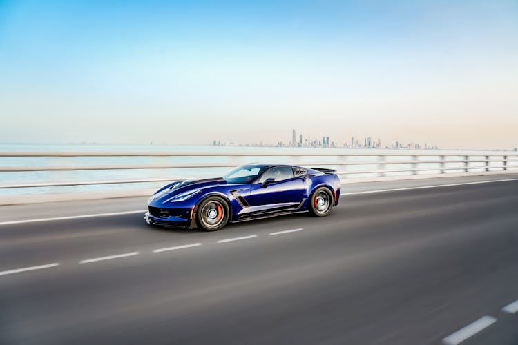 A Blue Chevrolet Corvette On The Road