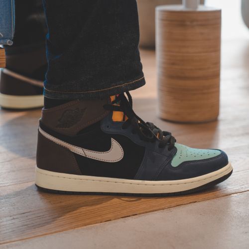 Free Close-up of fashionable Air Jordan sneakers on a wooden floor, capturing a trendy urban look. Stock Photo