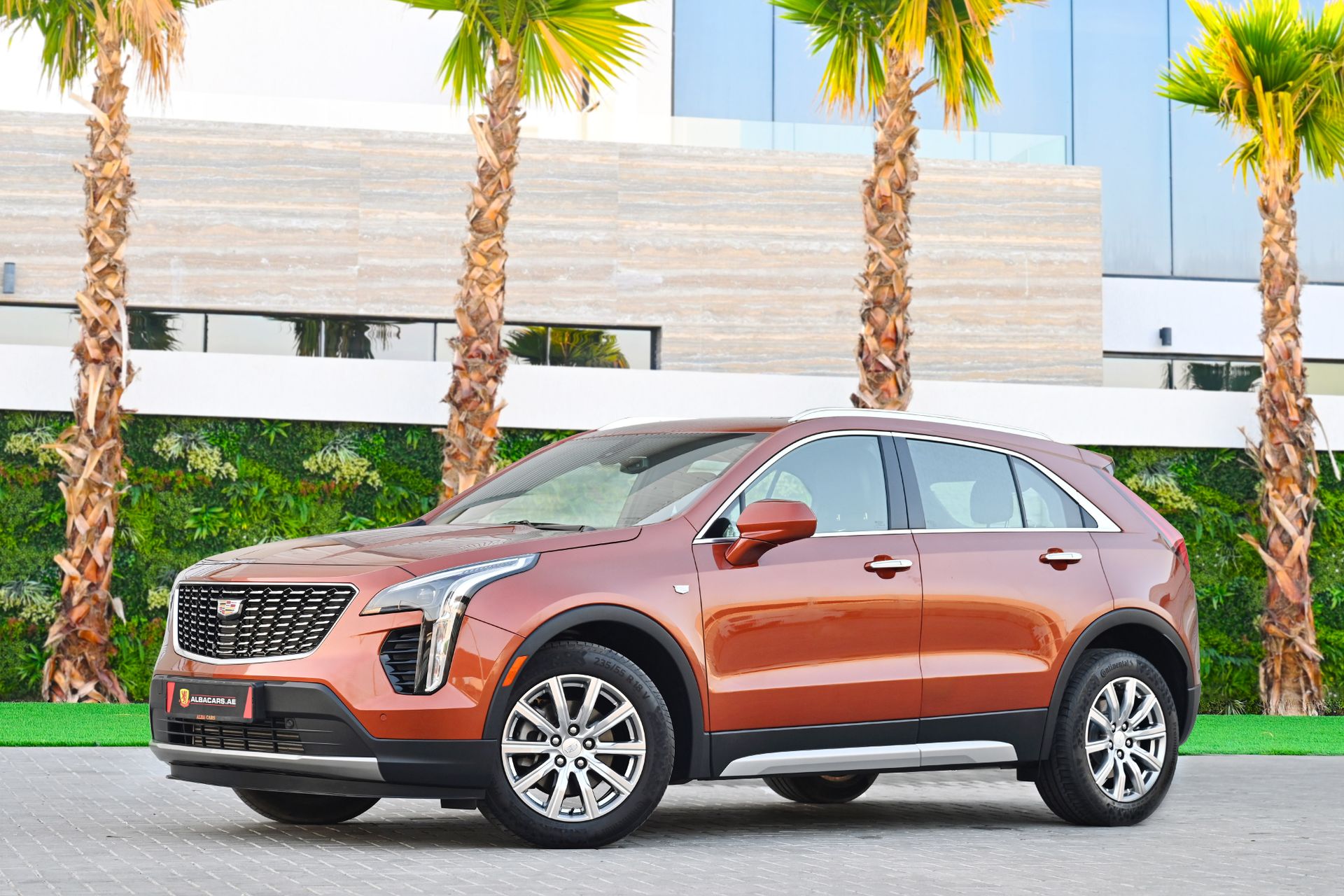 A sleek Cadillac SUV parked outdoors in Dubai, emphasizing luxury and modern design.