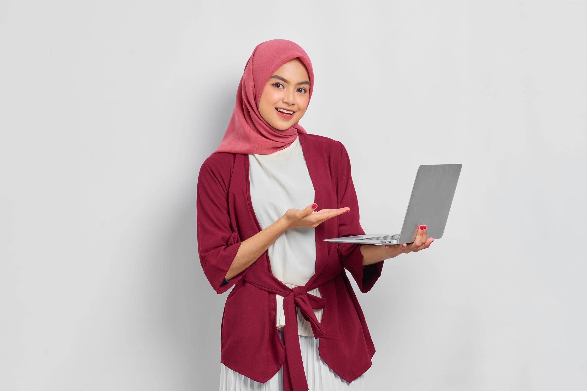 Woman Wearing Hijab Holding her Laptop · Free Stock Photo