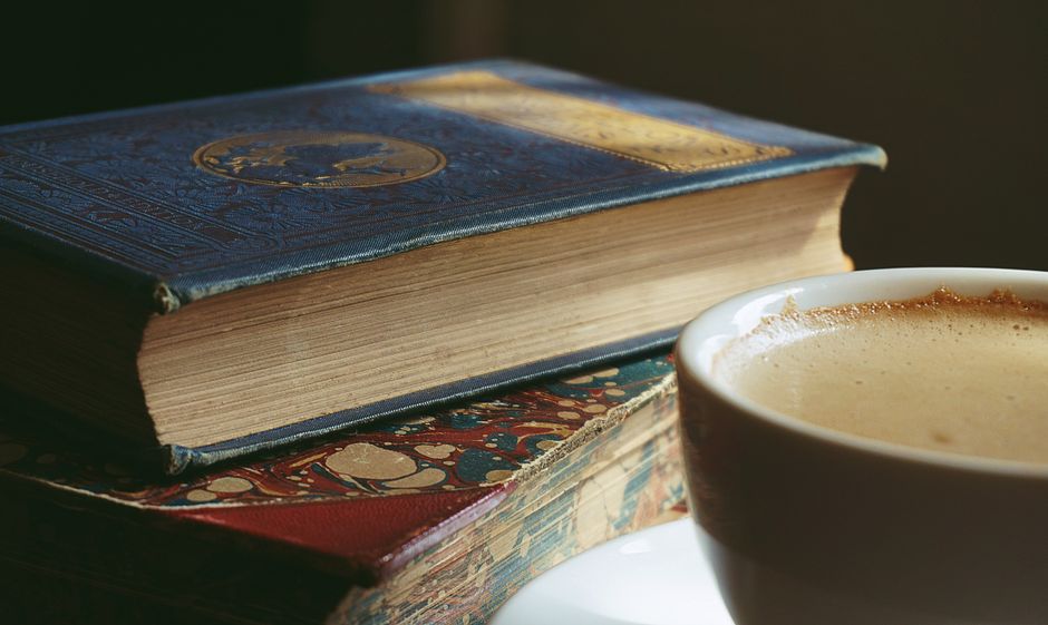 person sitting at kitchen table in early morning light staring into steaming mug of coffee - signs of burnout symptoms person sitting at kitchen table in early morning light staring into steaming mug of coffee - signs of burnout symptoms