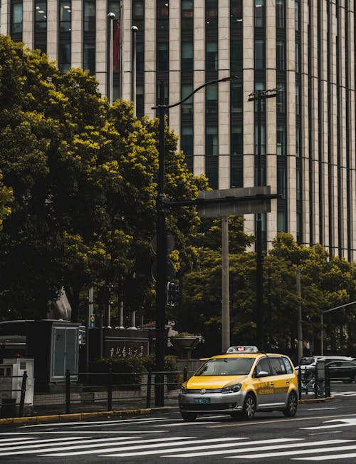Free A Yellow Taxi on the Street Stock Photo