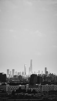 A black and white view of Shanghai's modern skyline featuring tall skyscrapers and urban architecture.