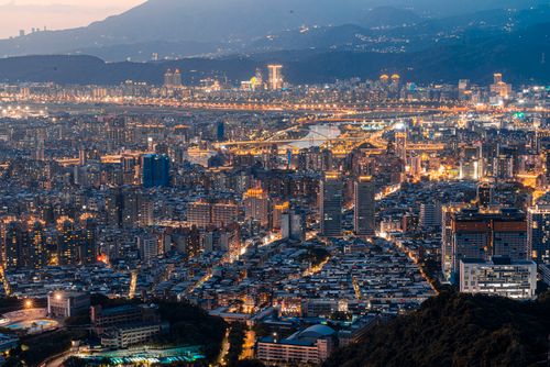 Free Captivating aerial view of illuminated Taipei cityscape with vibrant skyline and modern architecture. Stock Photo
