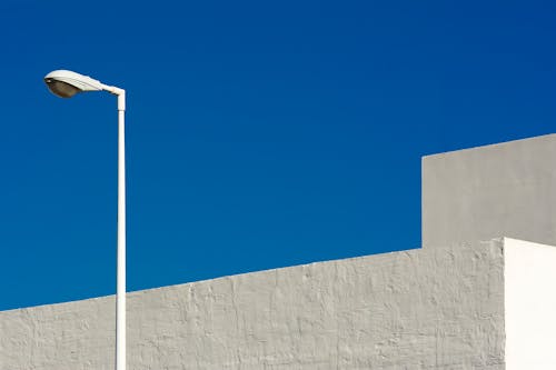 Lamp Post Beside a White Building