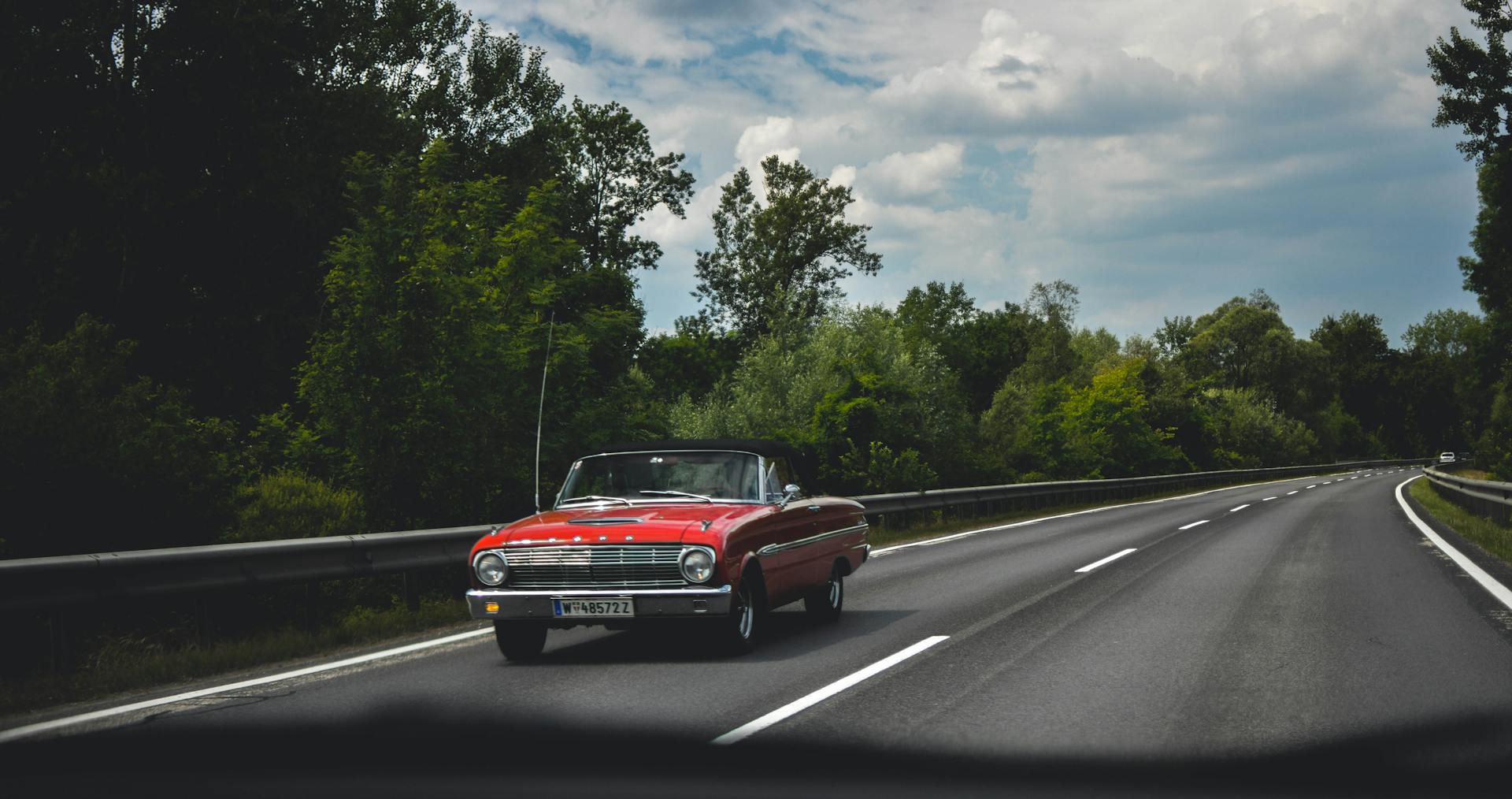 Photography of Red Car on Road