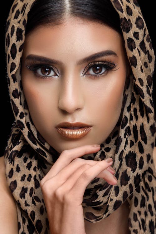 Free A Woman Wearing a Leopard Print Headscarf Stock Photo