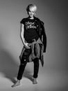 Woman in Black and White Adidas T-shirt and Black and White Plaid Skirt