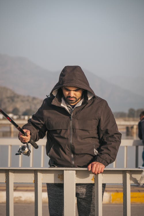 A Man Holding a Fishing Rod