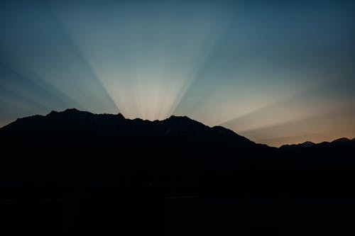 A Silhouette of a Mountain during the Sunrise