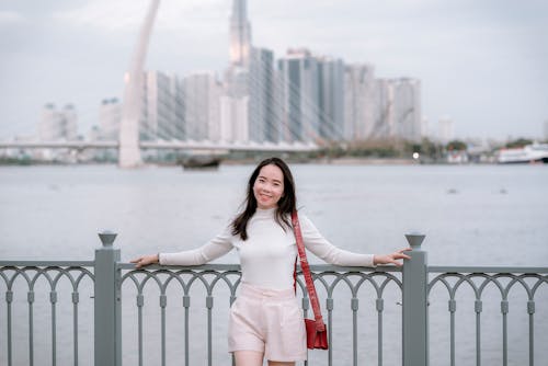 Woman Leaning on a Railing