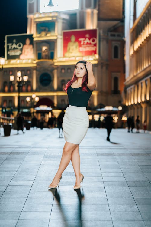 Woman Wearing Black Top and a Skirt