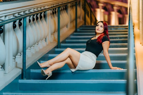 Woman Sitting on Staircase