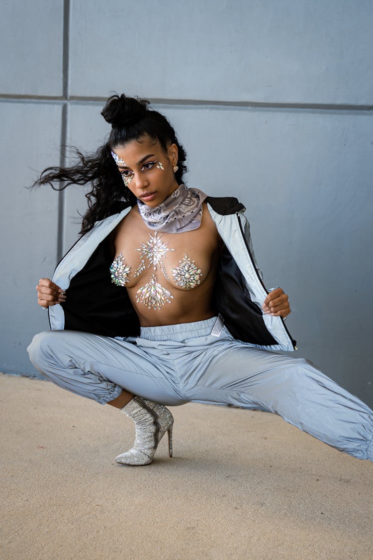 Woman With Crystals On Body And Face Kneeling