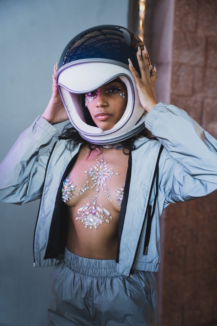 Portrait Of A Woman In Reflective Jacket And Motorcycle Helmet