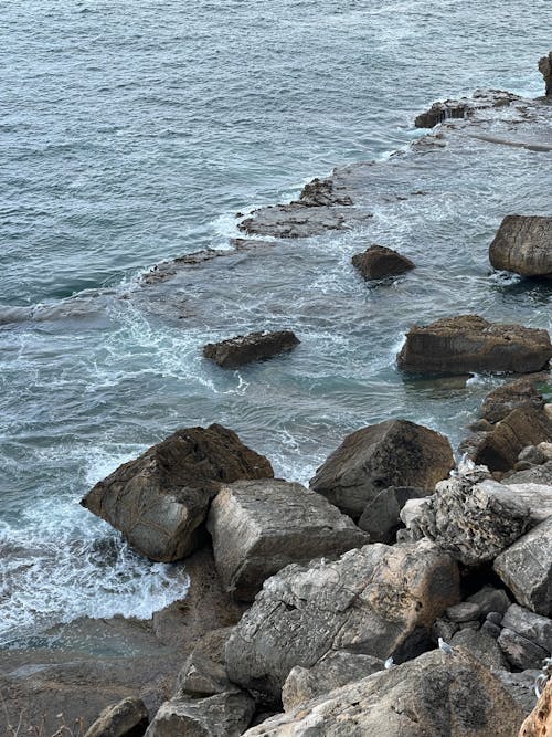 Free  Gray Rocks near Ocean Stock Photo
