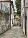 Narrow Alley between Concrete Houses
