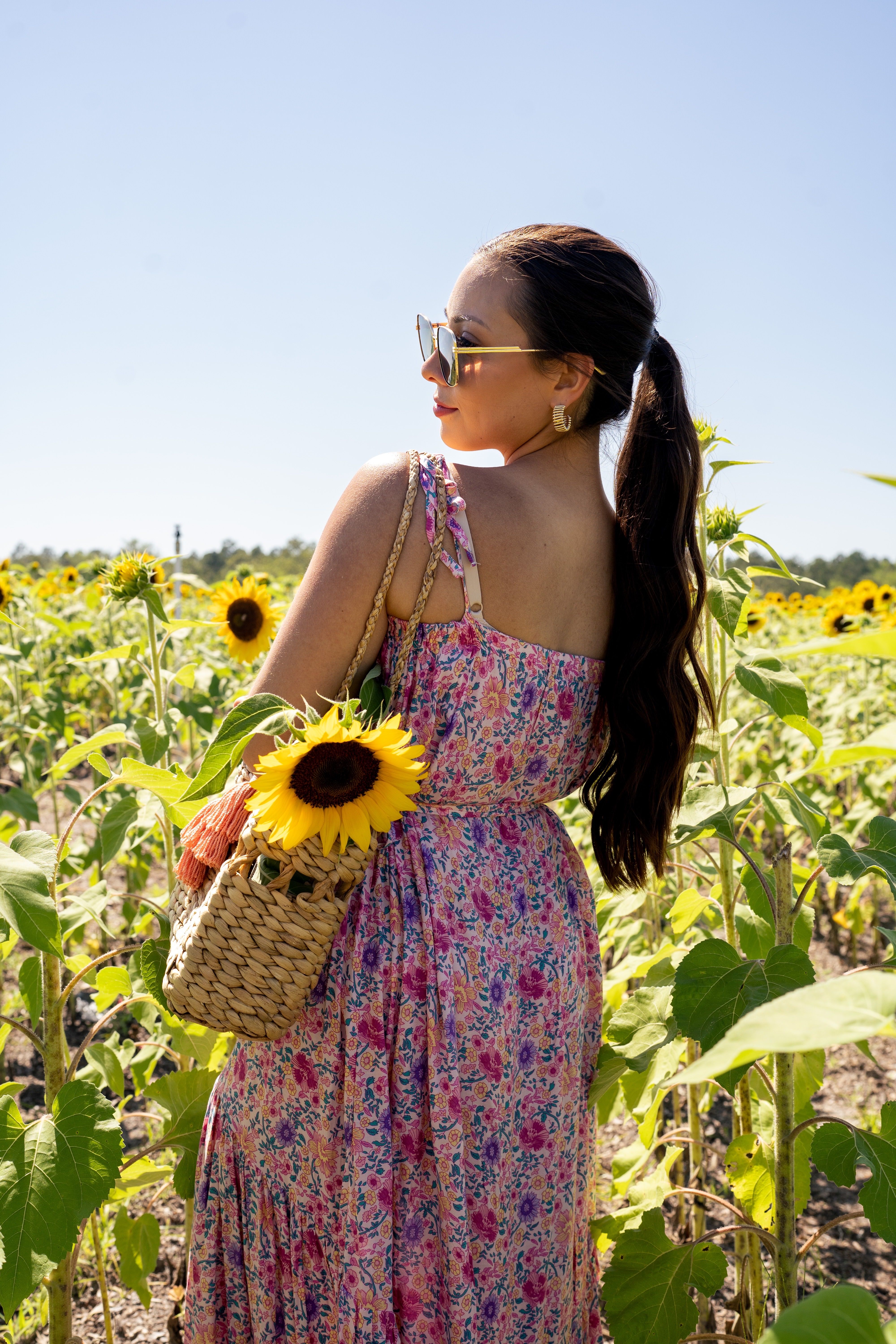 Woman in Floral Dress Standing in the Sunflower Field · Free Stock Photo