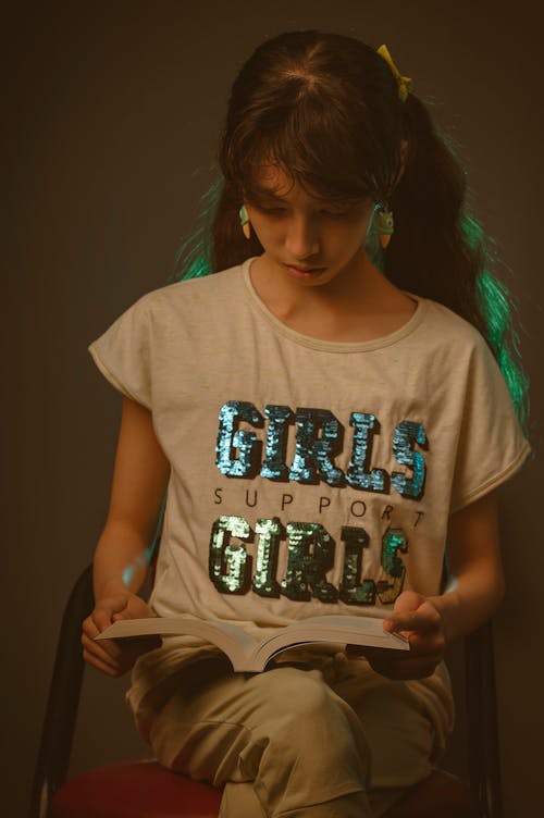 A Teenager Girl Reading a book