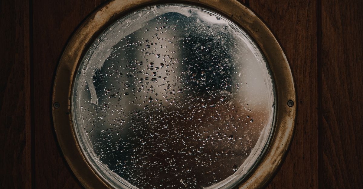 Round Window Scene A Round Glass Window on Wooden Wall · Free Stock Photo