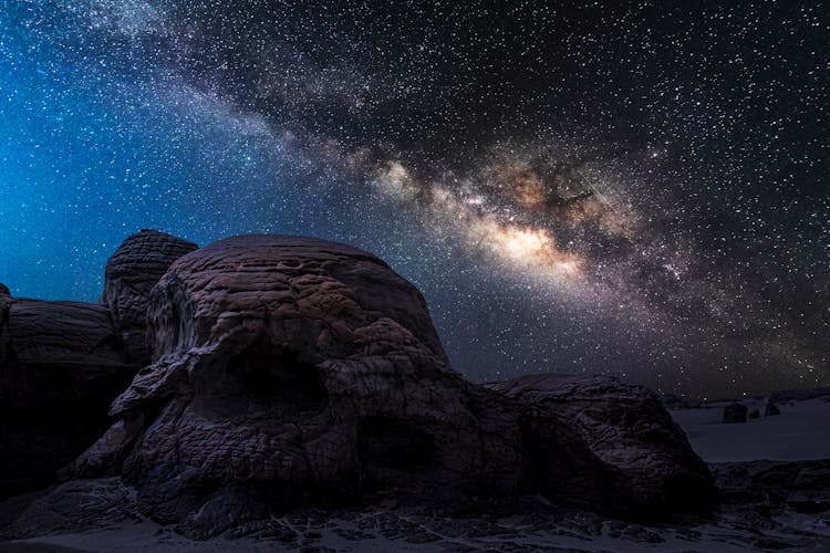 Rocks Under The Starry Night Sky