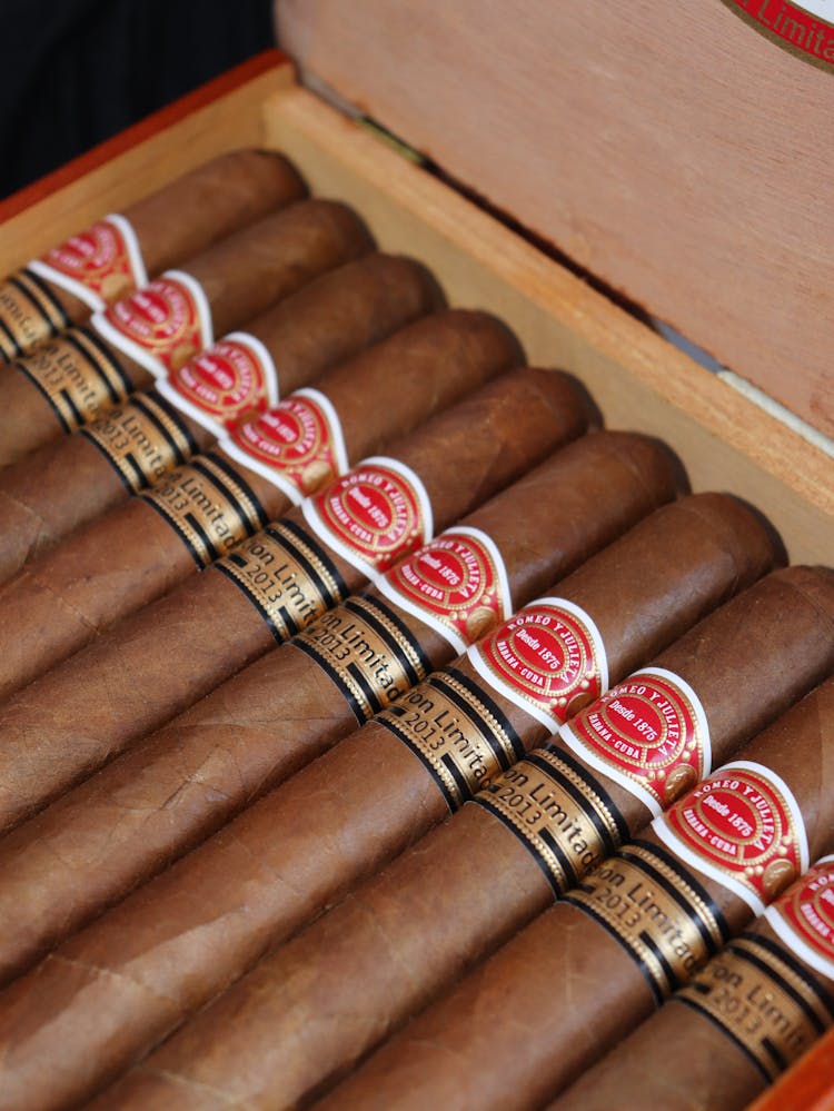 Brown Cigars In A Wooden Box