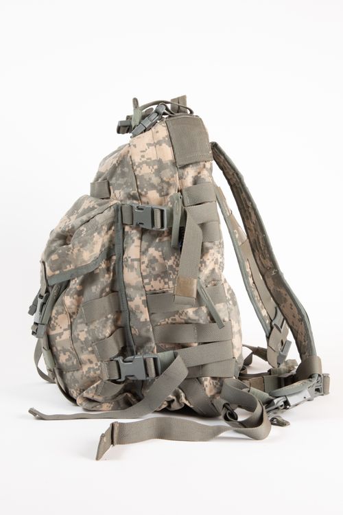 Free Close-up of a camouflage military rucksack on a white background. Stock Photo