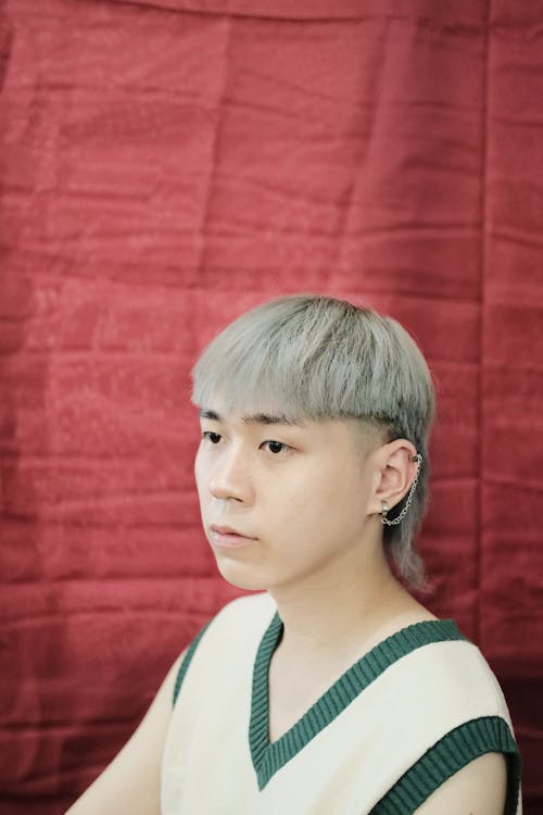 Close-Up Shot of a Man in Sweater Vest