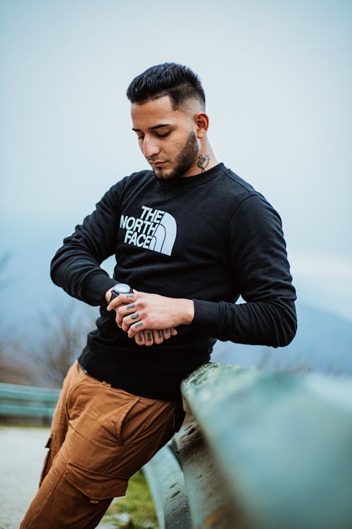 Bearded Man Looking at his Watch