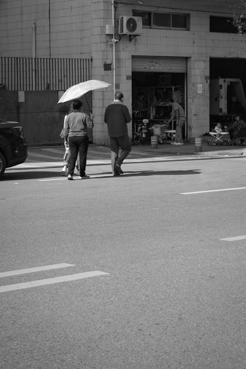 Grayscale Photo of People Walking on the Street 