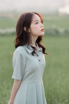Portrait of Petite Woman Looking Up