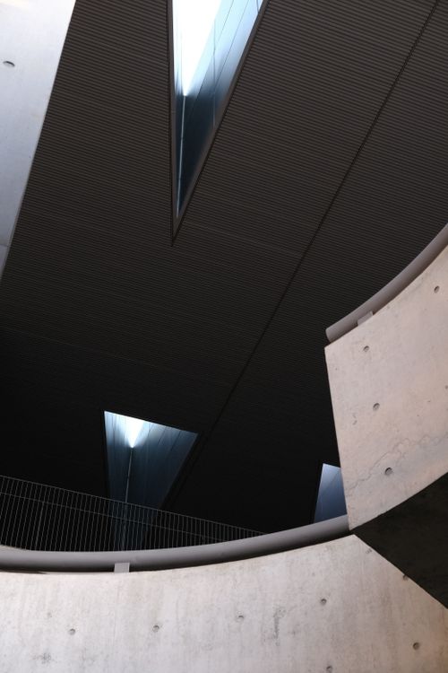 Free Abstract view of modern architectural design with concrete and geometric shapes. Stock Photo