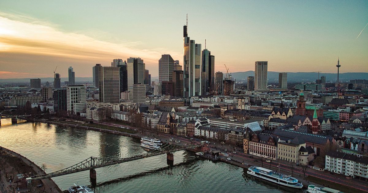 Frankfurt skyline and the Main River at sunset.