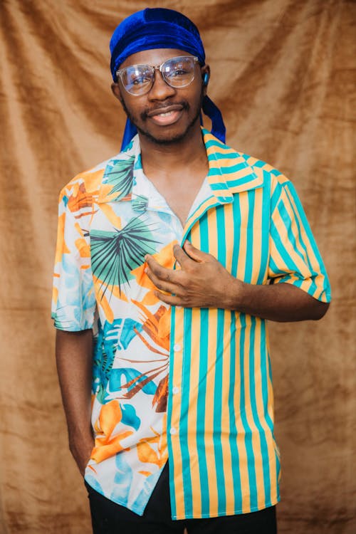 Man Wearing Eyeglasses and Blue Headscarf