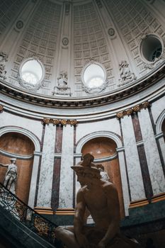 Brown Concrete Statue Inside Building