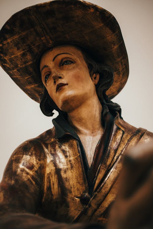Low Angle View of a Sculpture of a Woman in Hat