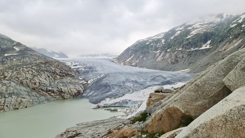 Free Explore the stunning glacier landscape with snow-capped mountains under a cloudy sky. Stock Photo